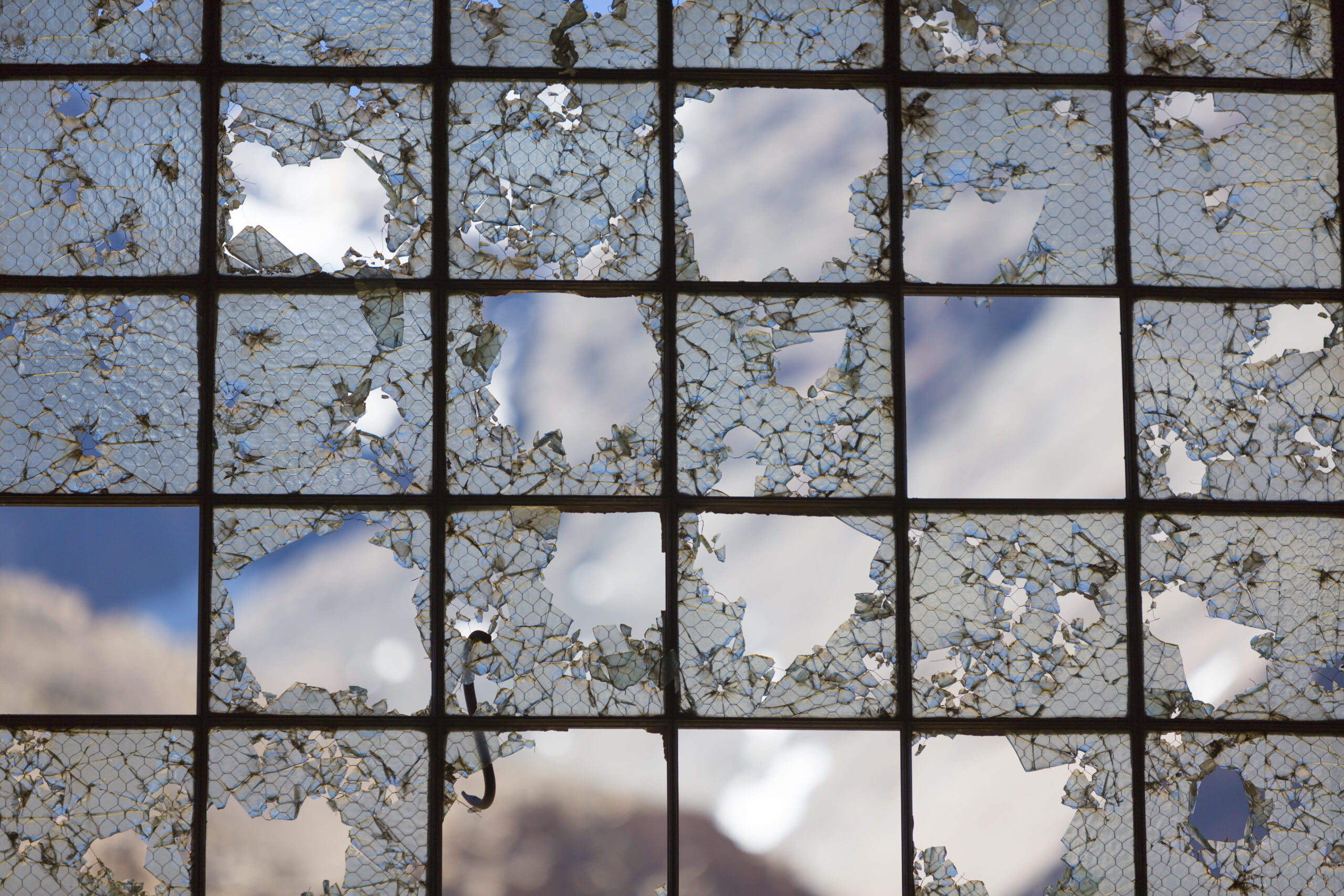 broken-glass-panes-with-view-of-cloudy-sky-2026-01-06-09-19-14-utc (1)